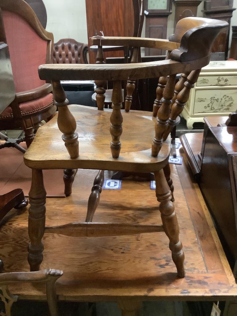 A Victorian elm and beech smoker's bow chair